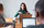 An image of 3 people in a meeting